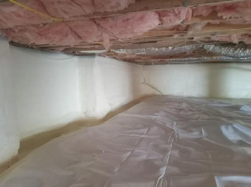 Crawl space encapsulation with closed-cell spray foam for Storm Damage Roof Repair in Charles City